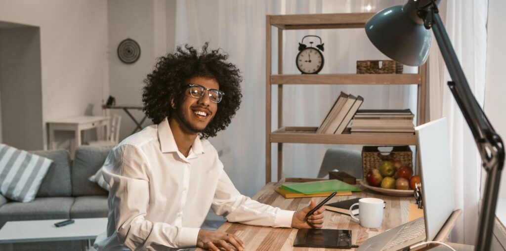 Young AI copywriter working remotely at a creative desk setup, exploring tools like Neuroflash and ChatGPT in 2025