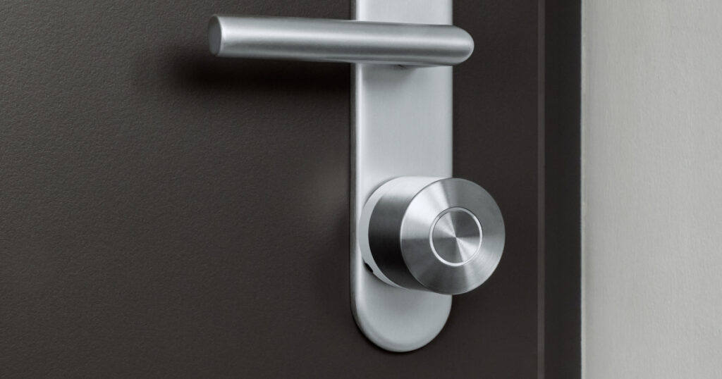 Nuki Smart Lock with AI-powered alerts installed on apartment door
