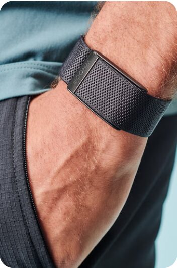 Athlete wearing Whoop 5.0 AI recovery and strain tracker