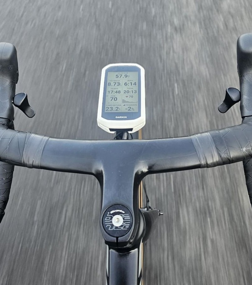 Garmin Edge 1050 AI cycling computer mounted on handlebar