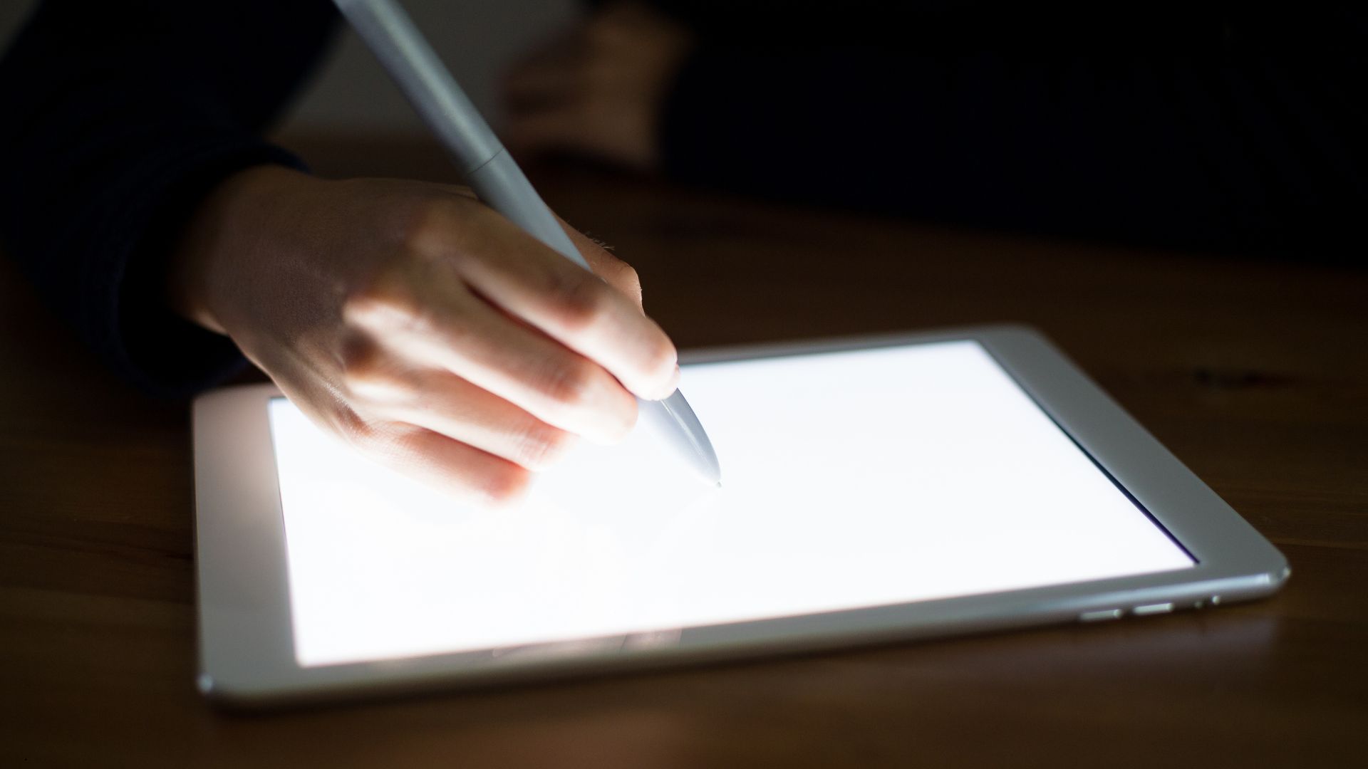 Writing on a tablet using creative writing with AI tools for a fiction scene