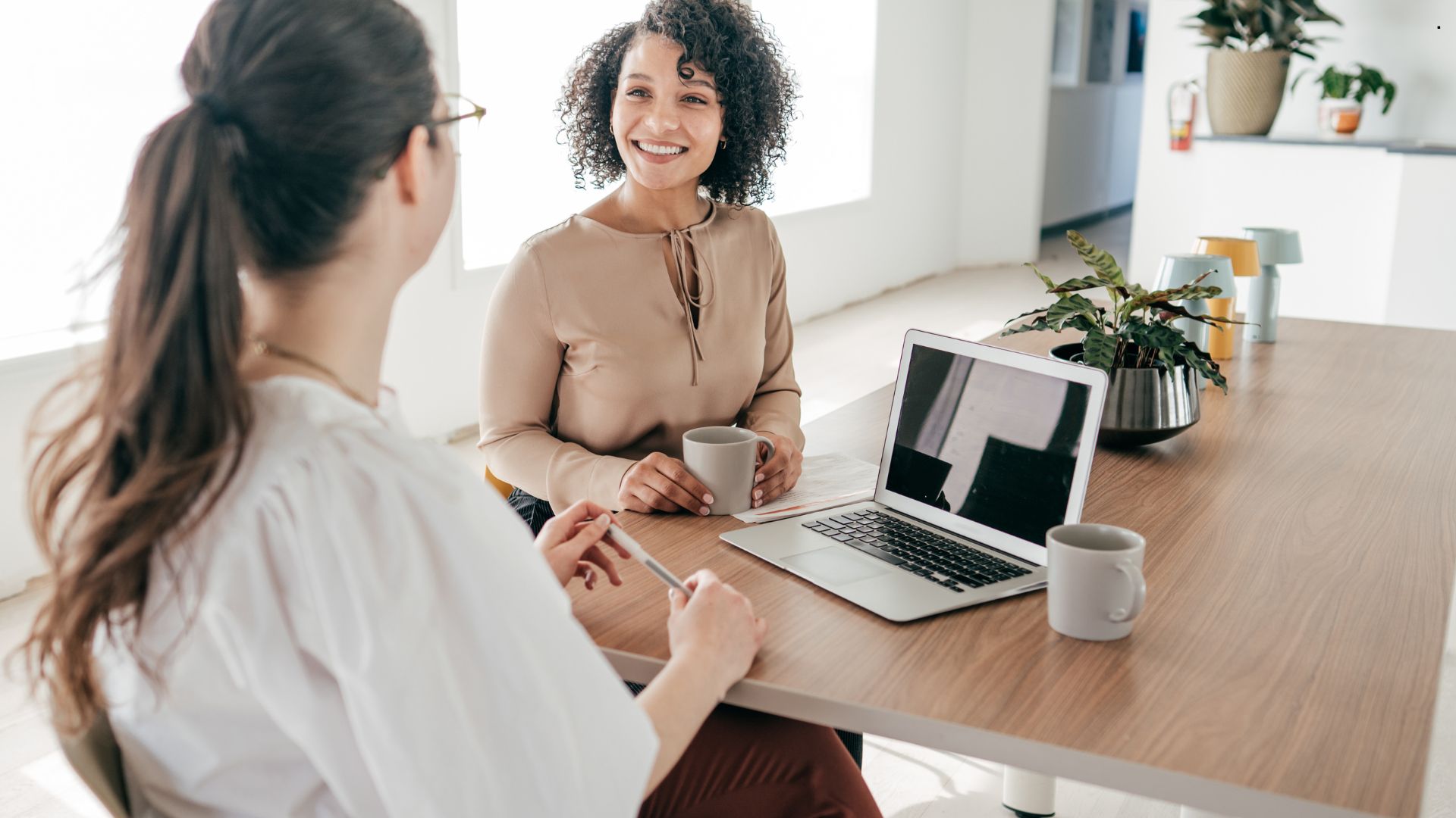 Interviewer using AI hiring tools to evaluate a candidate during a video interview